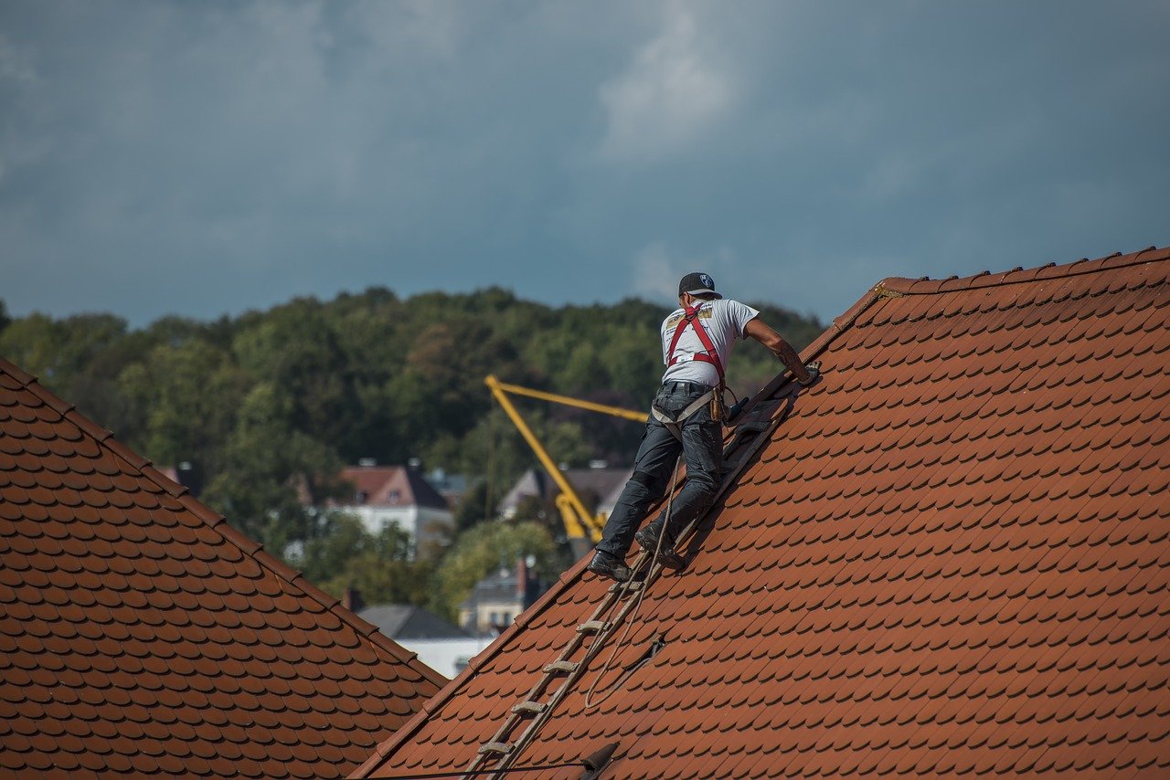 A roofer repairing a roof